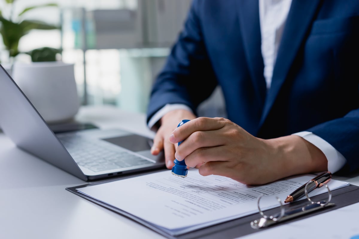 Notary stamping a loan document package